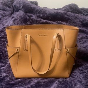 Micheal Kors purse, it does have a couple of stains.